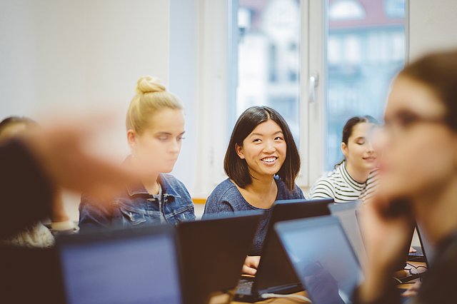 Young people in a classroom with computers.